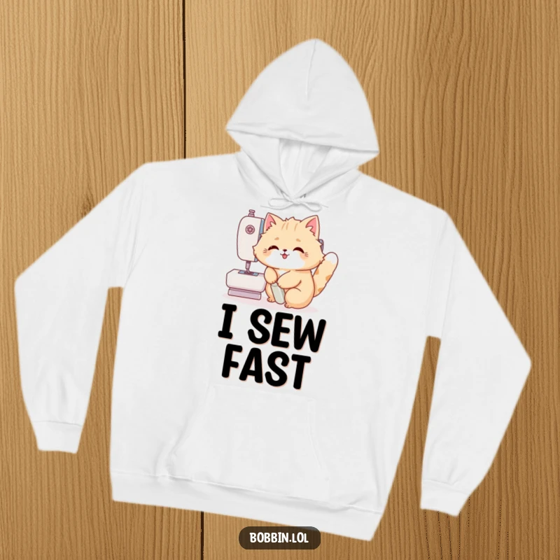 Funny Cat Hoodie: A fluffy cat enthusiastically pressing a sewing machine pedal, making crafting a laugh riot. Great funny gift.
