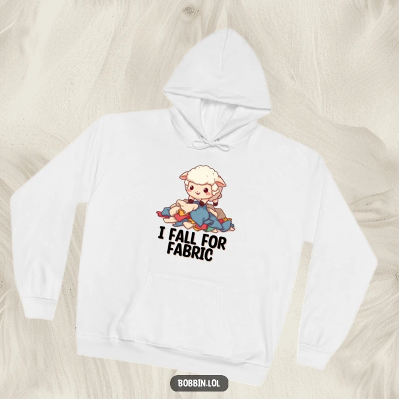 Funny Sheep Sewing Hoodie: A wobbly sheep stumbling over fabric scraps, great for cozy crafting. Perfect funny gift.