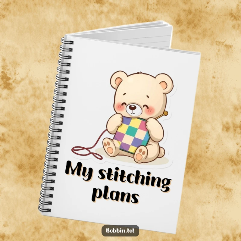 Funny notebook featuring a tiny bear happily stitching a colorful quilt square, inspiring notes with crafty charm and happiness.