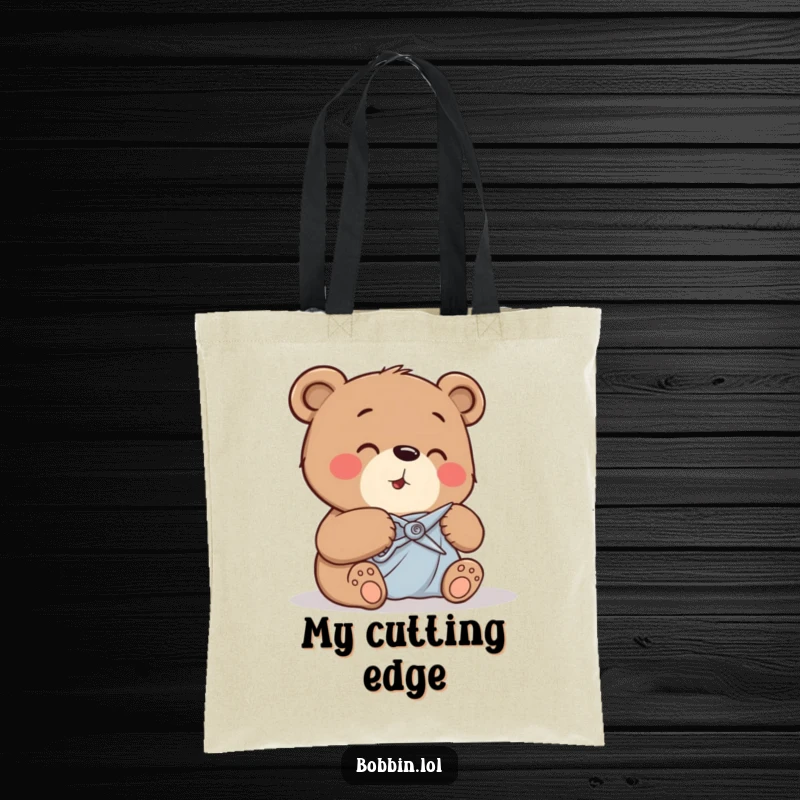 Funny bear cutting fabric with tiny shears, depicted on a durable tote bag for carrying craft supplies.